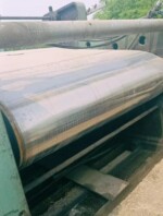 Side angle of used rubber vulcanise rotocure machine showing steel belt and roller size