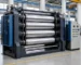 Four-roll rubber calender machine in a clean industrial workshop