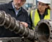 Buyer reviewing screw and barrel condition on a stopped rubber extruder