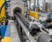 Profile output trial with measurement tools at a rubber extruder