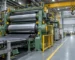 Rubber calendar machine with maintenance aisle and overhead lifting clearance