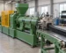 Illustrative rubber extruder and profile take-off conveyor for a startup trial